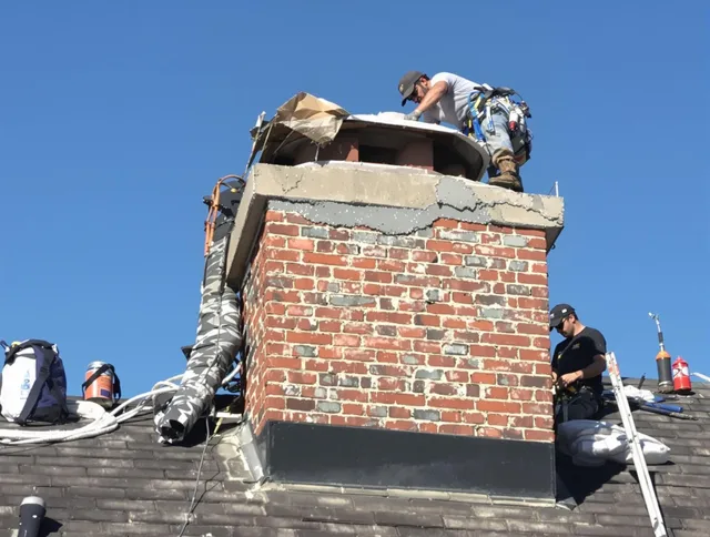 French Valley Chimney Sweep installing a custom chimney crown in French Valley, CA